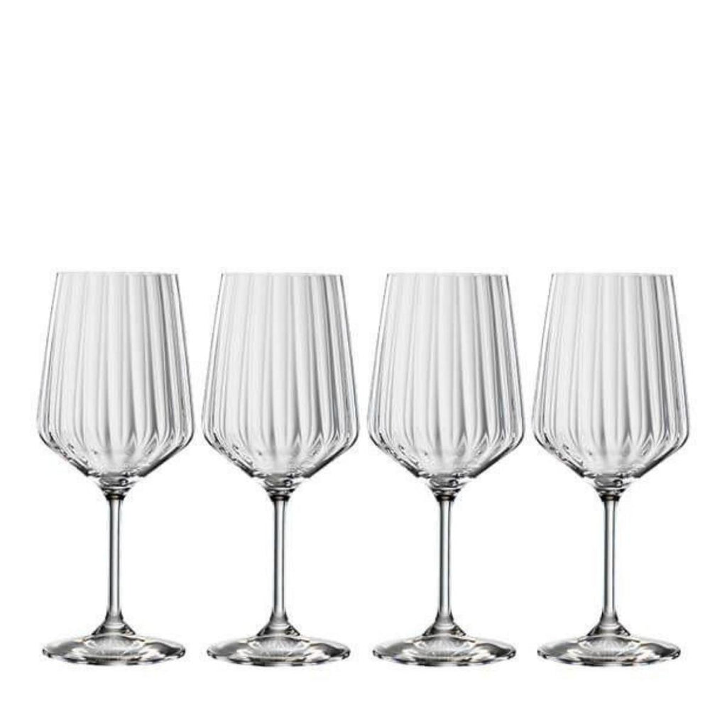 Four crystal red wine glasses with large bowls, shown together.